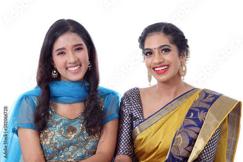 Two South east Asian Indian race ethnic origin woman wearing Indian dress costume sharee and salwar kameez multiracial community on white background photo