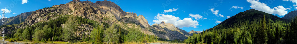 Beautiful rocky mountain with clouds background. Concept adventure. Natural background. Kora river gorge in Kazakhstan, way to Burkhan bulak waterfall. Tourism in Kazakhstan concept.