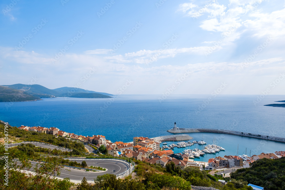 Scenic view on Lustica Bay, Montenegro. Coastline port with a lighthouse