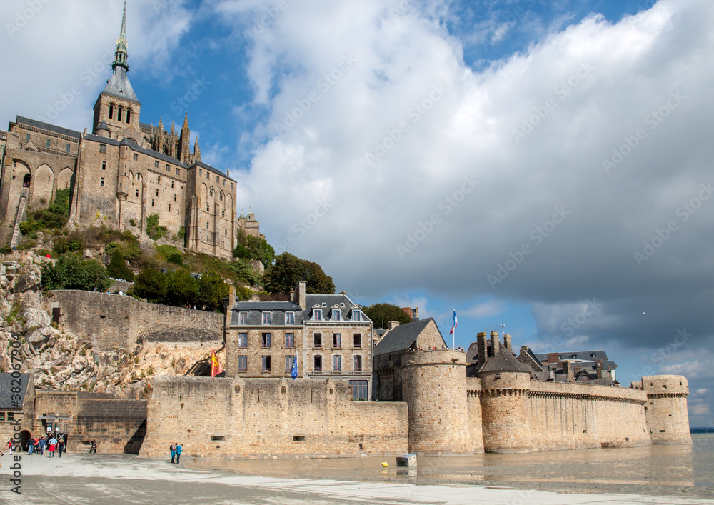 Obraz premium Le Mont Saint-Michel, medieval fortified abbey and village on a tidal island in the Normandy, France, at low tide