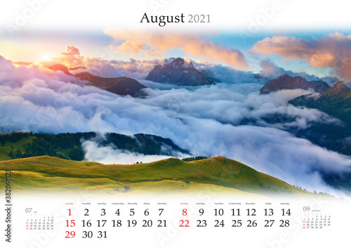 Calendar August 2021, B3 size. Set of calendars with amazing landscapes. Beautiful foggy sunrise in Italian Alps. Dolomites, South Tyrol, Italy, Europe.