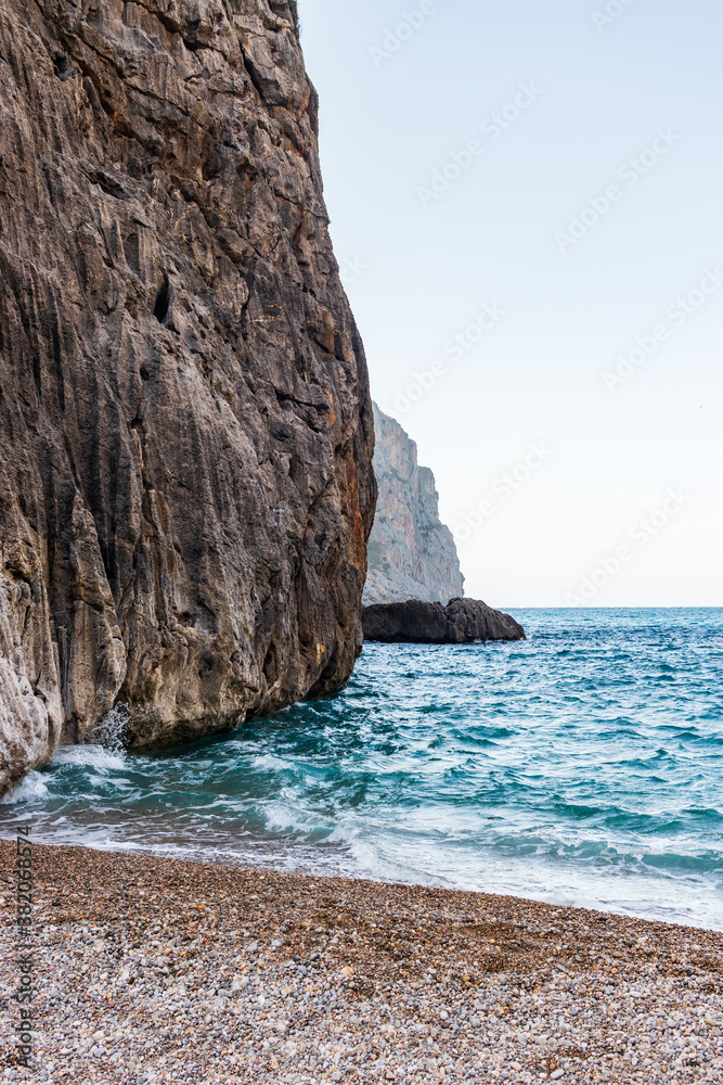 Fototapeta premium Sunny day over the rocks and the blue water in Sa Calobra, Palma de Mallorca, Balearic Islands, Spain