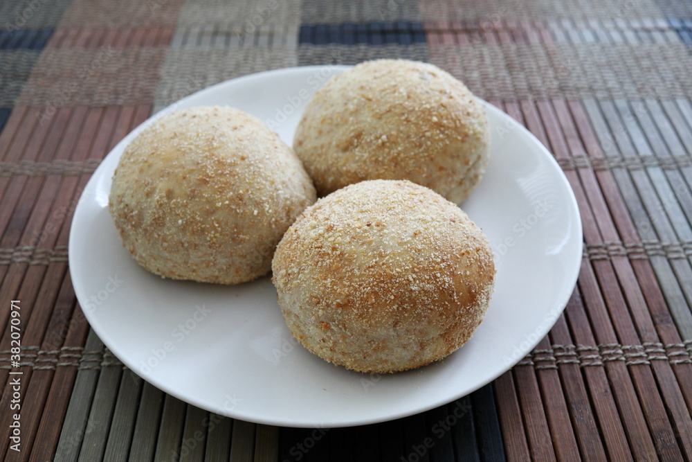 Fresh baked pandesal on white plate. Fresh baked pandesal on white plate.