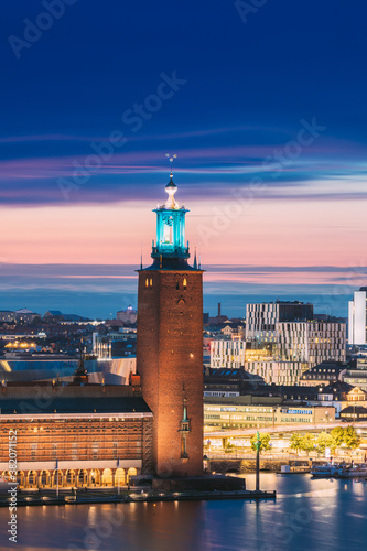 Stockholm  Sweden. Famous Tower Of Stockholm City Hall. Popular Destination Scenic In Sunset Twilight Dusk Lights. Evening Lighting.