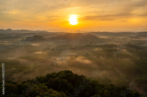 Landscape of beautiful morning fog sunrise in southern of Thailand