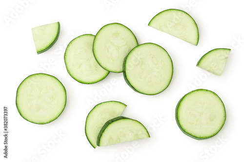 Fresh sliced zucchini isolated on white background with clipping path and full depth of field. Top view. Flat lay