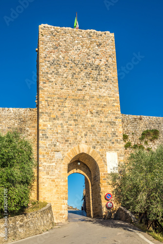 View of the gate to the walls of the medieval town of Monteriggioni - Italy photo