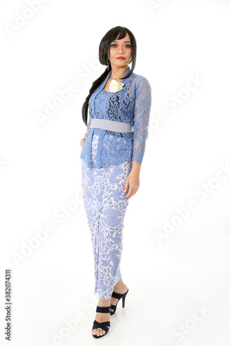 South east Asian Malay race ethnic origin woman wearing dress costume blue kebaya multiracial community on white background photo