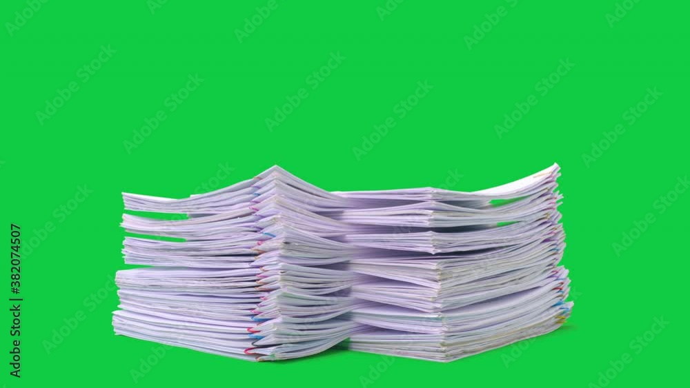 Stop motion animation Stacks overload document paper files on chroma key green screen background. Alpha Channel.
