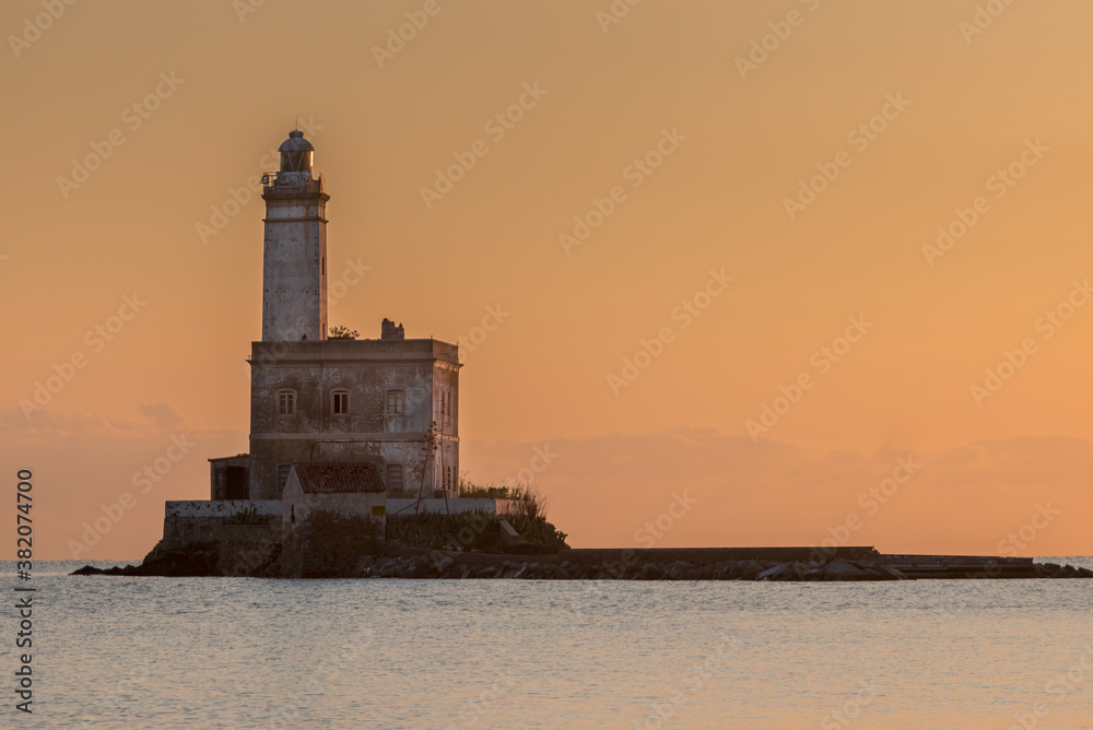 Fototapeta premium Lighthouse on the island of Mouth, at the entrance to the port of Olbia, Sardinia - Italy