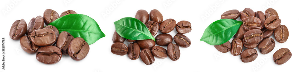 Heap of roasted coffee beans with leaves isolated on white background . Top view. Flat lay. Set or collection Heap of roasted coffee beans with leaves isolated on white background . Top view. Flat lay. Set or collection