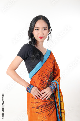 South east Asian Chinese race ethnic origin woman wearing Indian dress costume Sharee multiracial community on white background photo