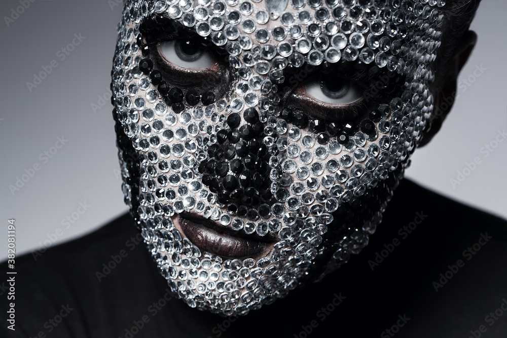 serious woman with rhinestone skull serious woman with rhinestone skull