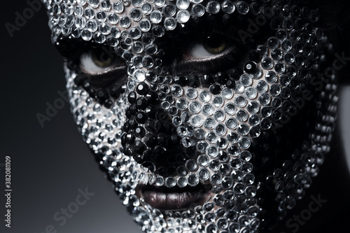 scary woman with skull face of rhinestones