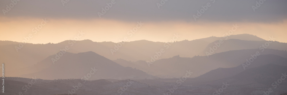 Panorama of sunrise in the mountains.