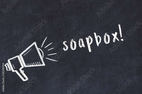 Chalk sketch of loudspeaker and inscription soapbox