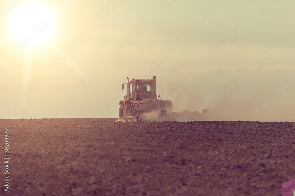 Naklejka premium agricultural machines at work in the field