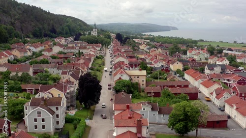Aerial view of Granna Swedish village at countryside. Drone shot of small town in Sweden known for Polkagris. Lake Vattern in Jonkoping Municipality photo