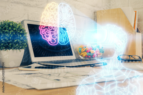 Computer on desktop with AR theme icon. Multi exposure. Concept of augmented reality.