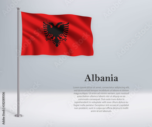 Waving flag of Albania on flagpole. Template for independence day