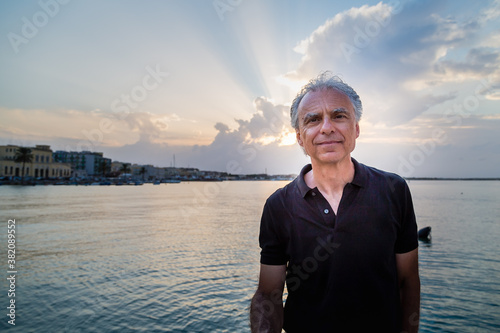 handsome senior man smiling photo