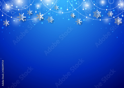 雪の結晶がぶら下がった キラキラ イルミネーションのクリスマス背景 フレーム 青