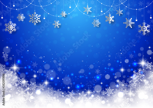 雪の結晶がぶら下がった キラキラ イルミネーションのクリスマス背景 フレーム 青