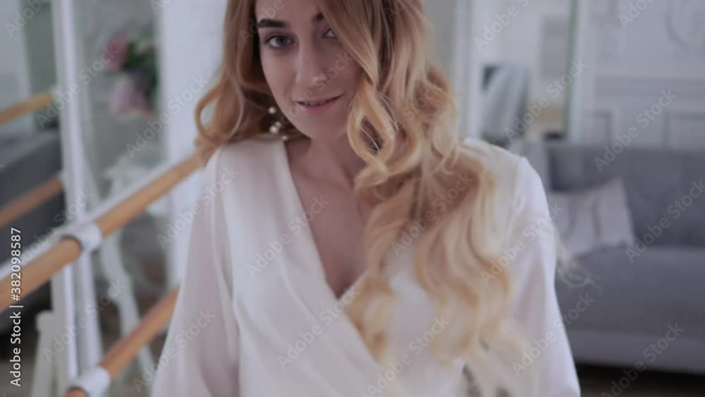 Beautiful elegant bride in a simple white wedding dress with sleeves, Close-up portrait Beautiful elegant bride in a simple white wedding dress with sleeves, Close-up portrait