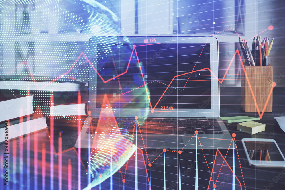 Forex Chart hologram on table with computer background. Multi exposure. Concept of financial markets. Forex Chart hologram on table with computer background. Multi exposure. Concept of financial markets.
