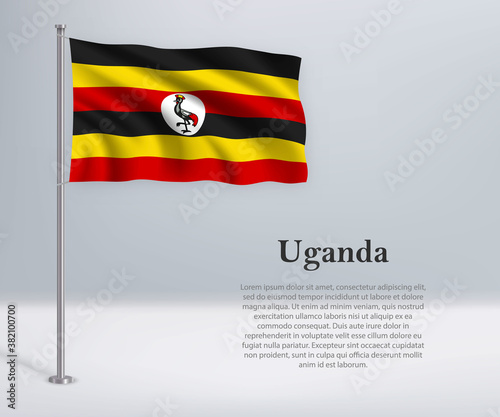 Waving flag of Uganda on flagpole. Template for independence day