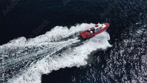 Wallpaper Mural Aerial drone tracking video of red pilot boat cruising in high speed in Mediterranean deep blue sea offering navigational aid to ships Torontodigital.ca