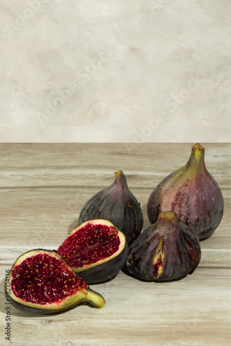 some mature purple figs on the table