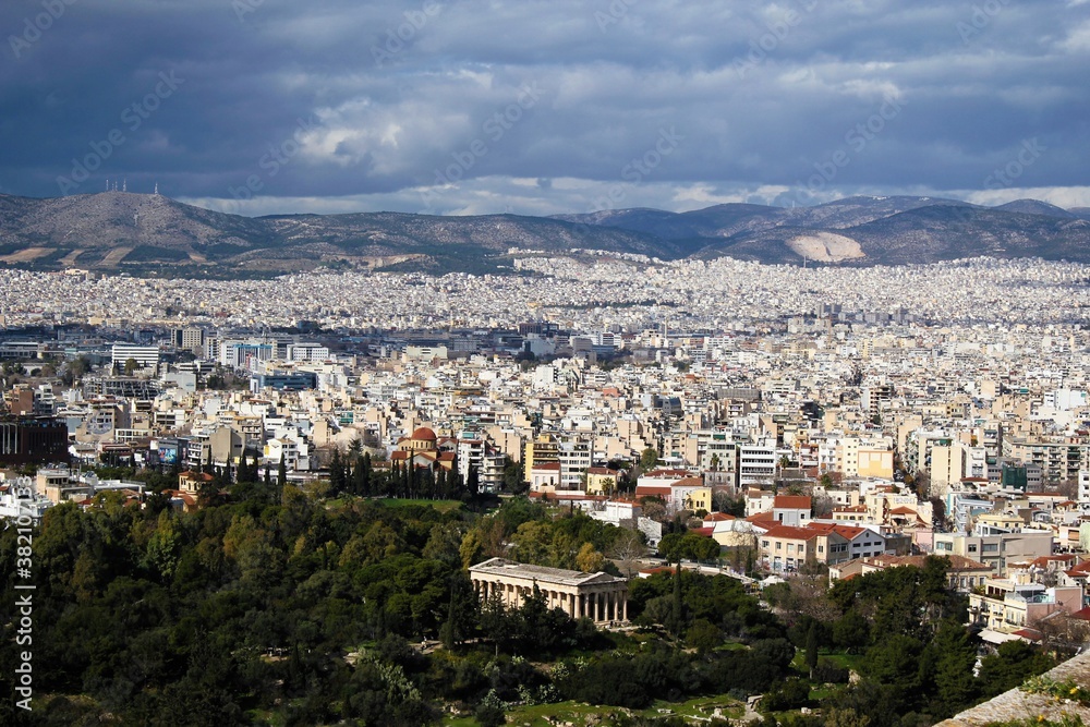 Partial view of Athens city from the Acropolis hill with the temple of Hephaestus in the foreground - Athens, Greece, February 2 2020.