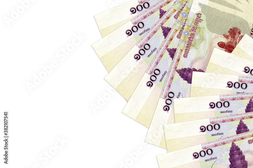 100 Cambodian riels bills lies isolated on white background with copy space. Rich life conceptual background photo