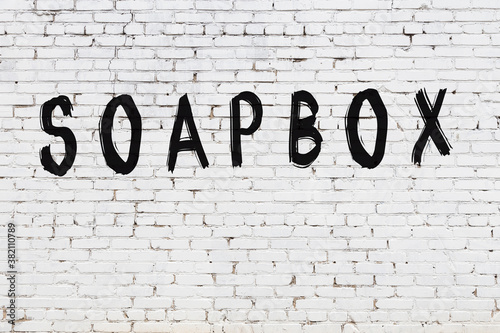 Foto Inscription soapbox painted on white brick wall