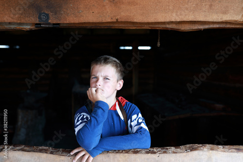 Boy in wooden window