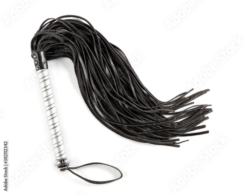 Flogger of whip in closeup on a white background