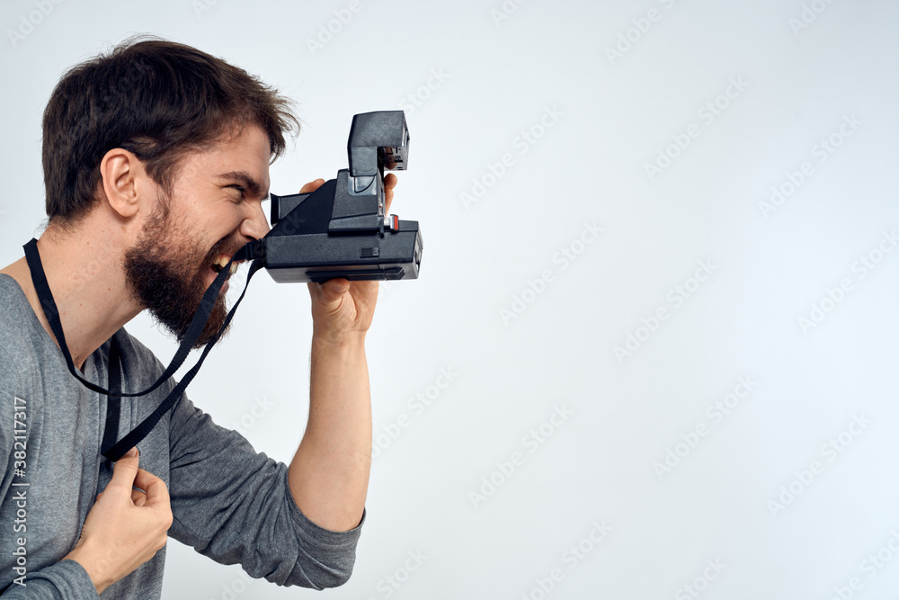male photographer holding camera professional lens creative studio work light background male photographer holding camera professional lens creative studio work light background