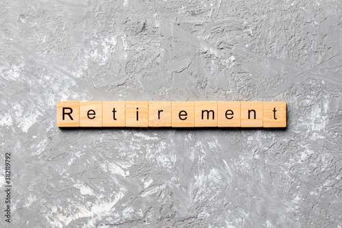 retirement word written on wood block. retirement text on cement table for your desing, concept