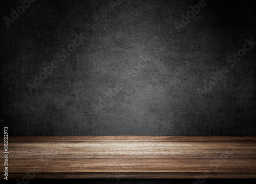 Wooden table on black wall in dark room background for product montage. 3d illustration