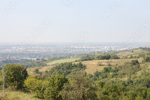 Aerial panoramal of Novi Sad  seen from a hill of Fruska Gora National park during a summer afternoon. Novi Sad is the capital city of Vojvodina and a major place in Serbia
