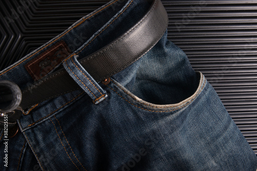 empty blue jean side pocket on dark background