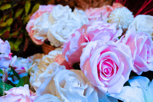 bouquet of roses in vase. Yellow, Red and Orange Rose Foral Background. Beautiful flowers as background. Close up flowers background colourfu purple Gerbera flowering in garden,Summer or Spring day 