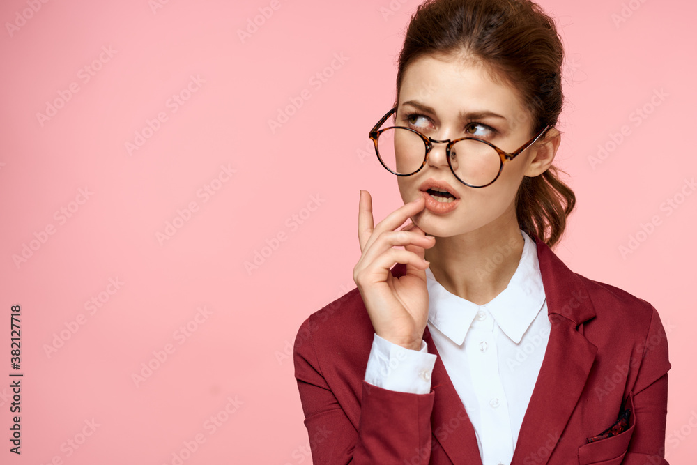 Business woman red jacket glasses executive lifestyle studio pink background Business woman red jacket glasses executive lifestyle studio pink background