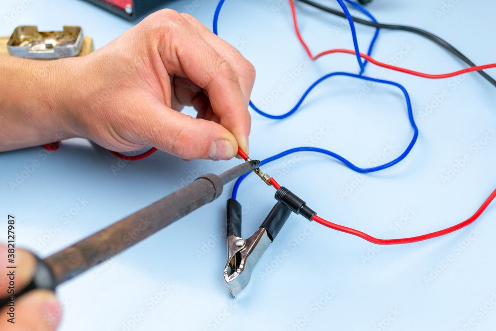 Jumper cable, on a blue background Jumper cable, on a blue background