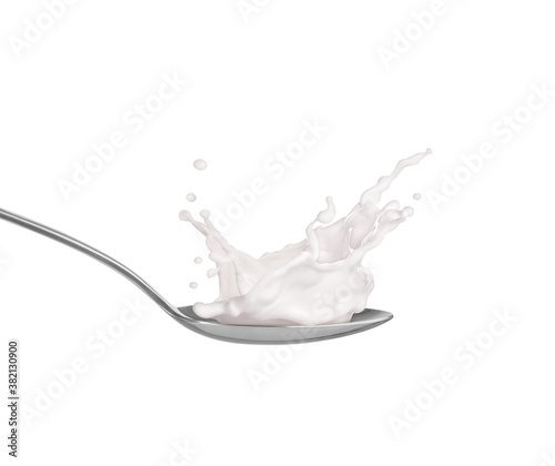 milk with splashes in a spoon on a white background