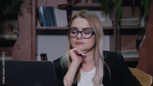 Thoughtful concerned young woman working on laptop computer looking away thinking solving problem at home office, serious woman search for inspiration make decision feel lack of ideas, close up view