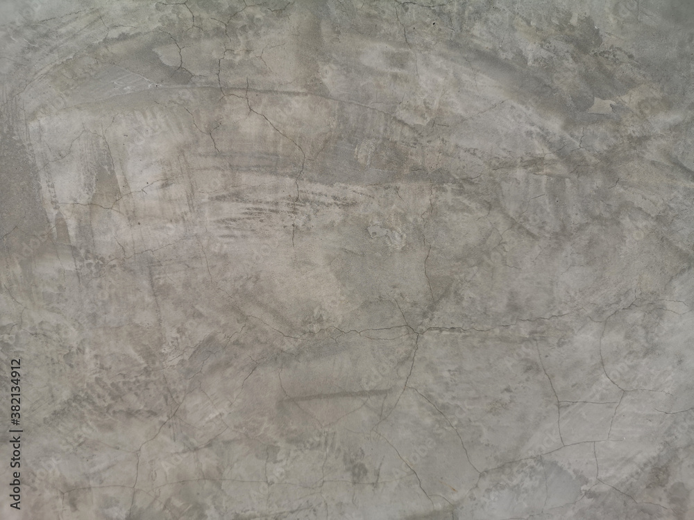 Cracks on the Cement wall has gray color and smooth abstract surface texture concrete material background
