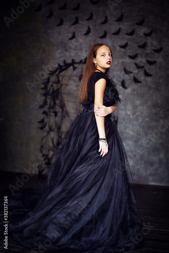 
halloween style girl in long black dress