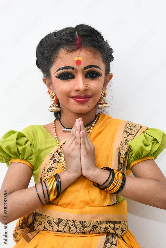 Premium Photo | Portrait of beautiful traditional indian girl posing on  white wall.